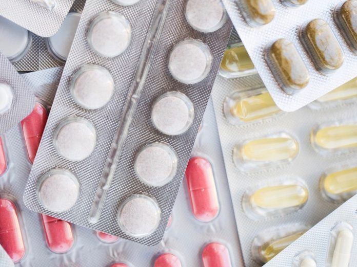 different pills and capsules of drugs