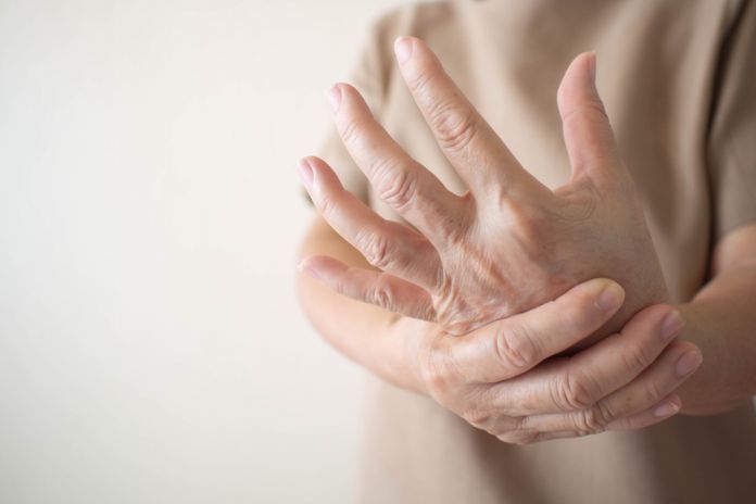 Elderly,Woman,Suffering,From,Pain,,Numbness,Or,Weakness,In,Hands.